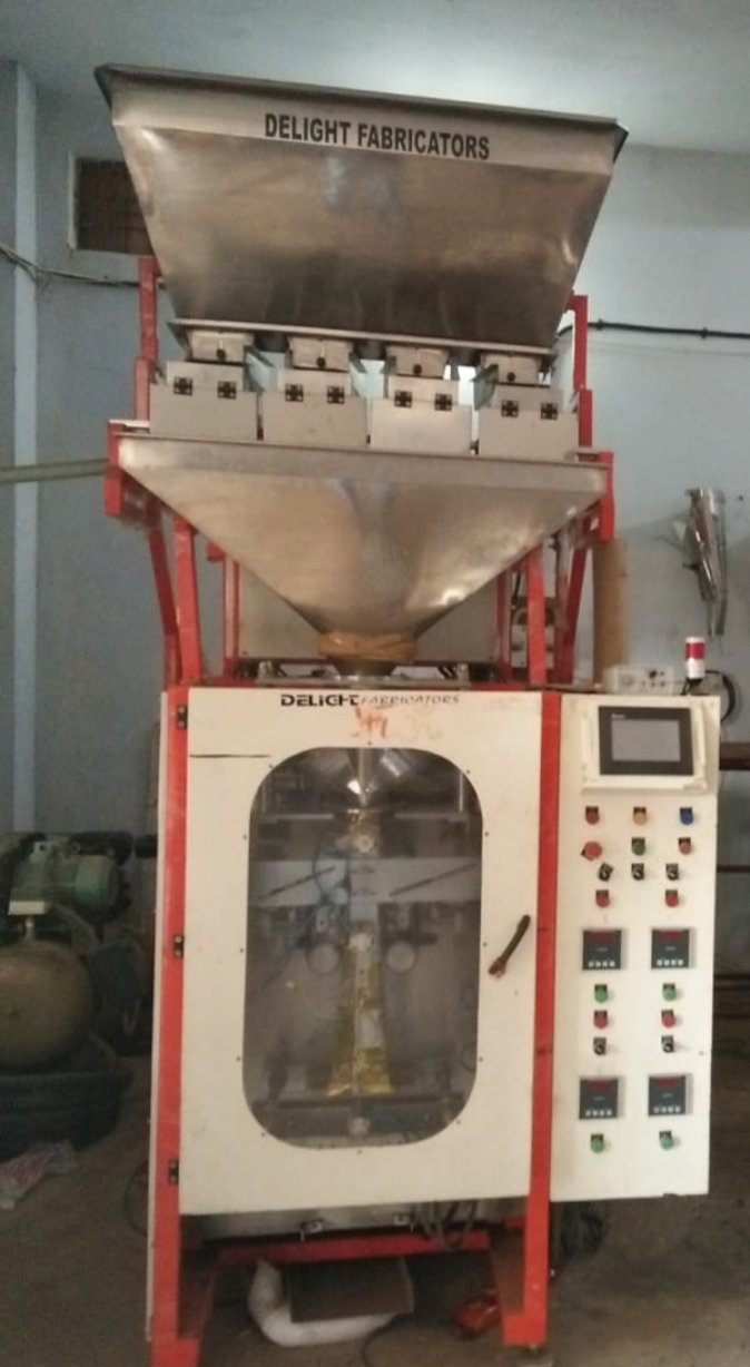 Horizontal Band Sealer Delight Fabricators Fully Automatic Four Head Weigher Pouch Packing Machine